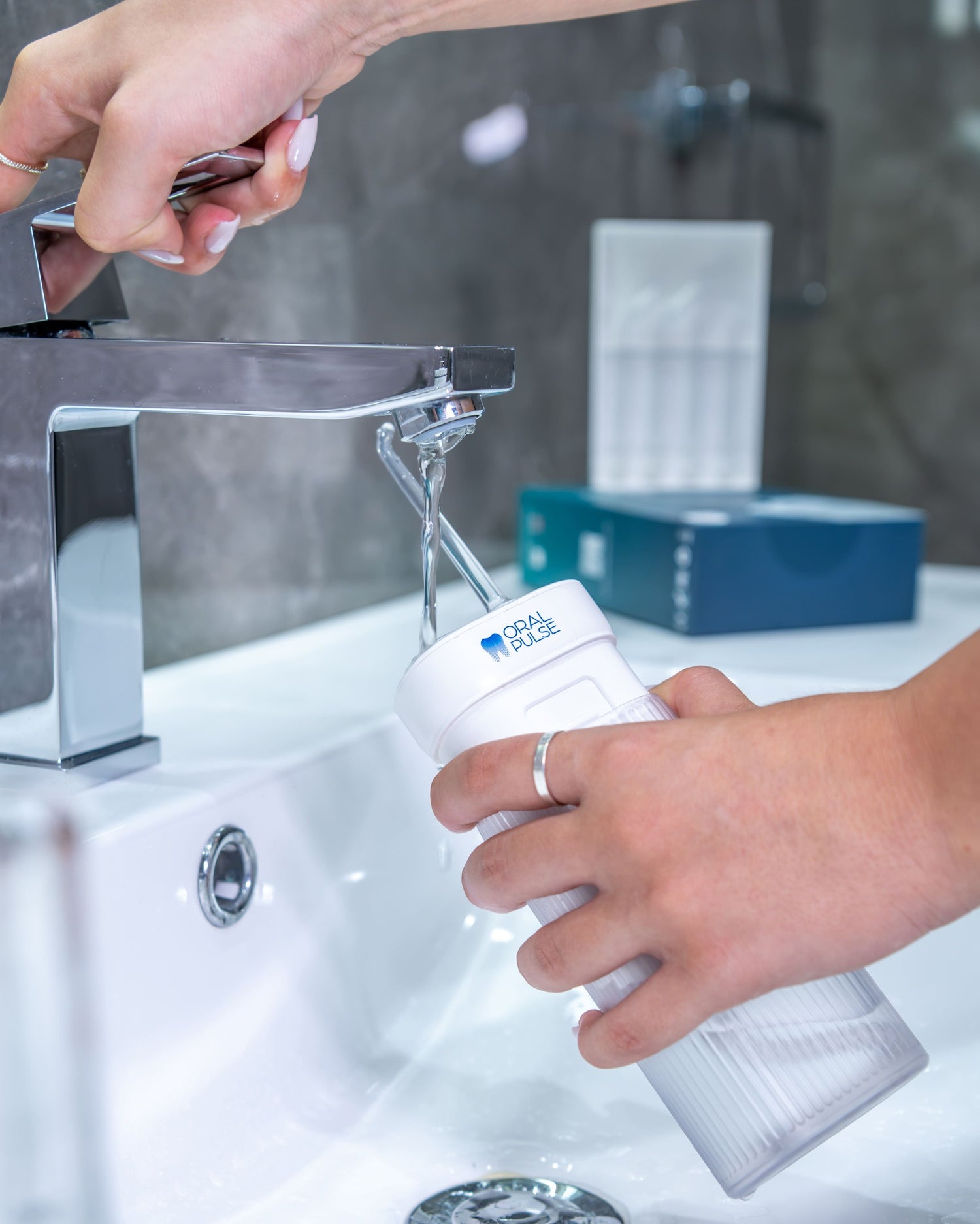 Filling water in the portable water flosser to remove the plaque